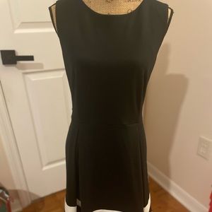 Calvin Klein black dress with white stripes at the edge of the dress